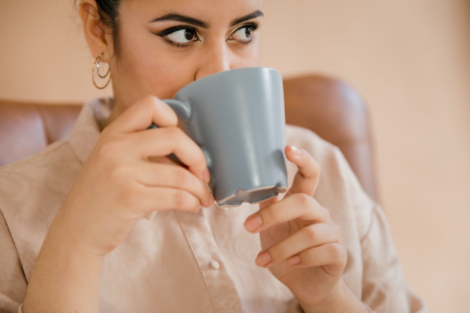 Women sipping coffee with dermal fillers